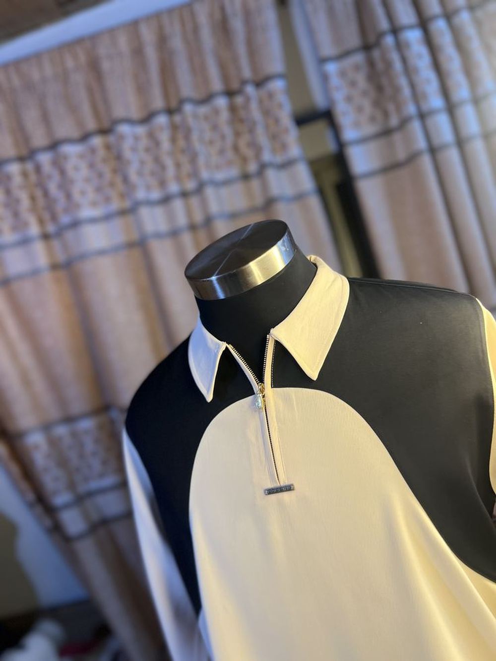 The Ivory Zip Polo — cream and black colourblock polo